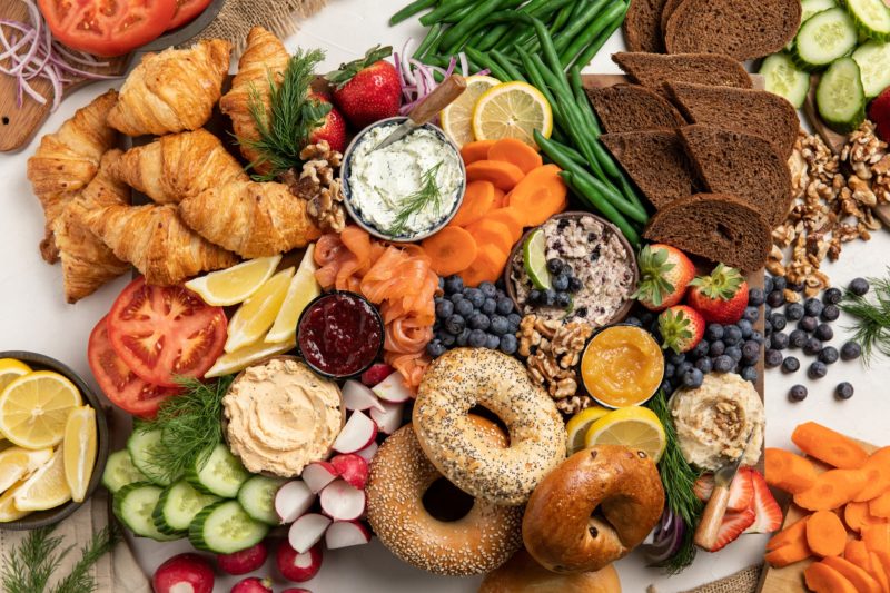 Table loaded with produce and baked goods.