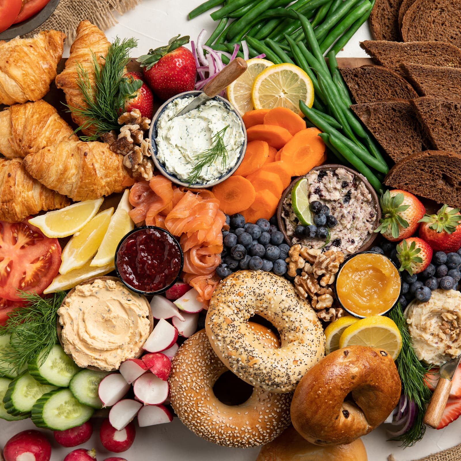 Table loaded with produce and baked goods.