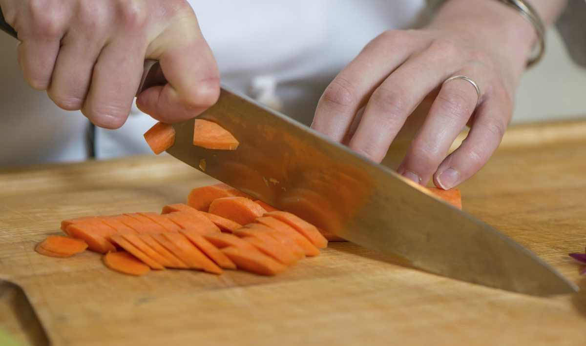 chef chopping carrots